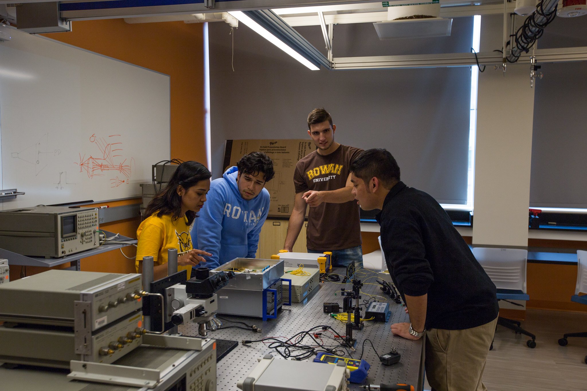 a group of international students inside an engineering lab.