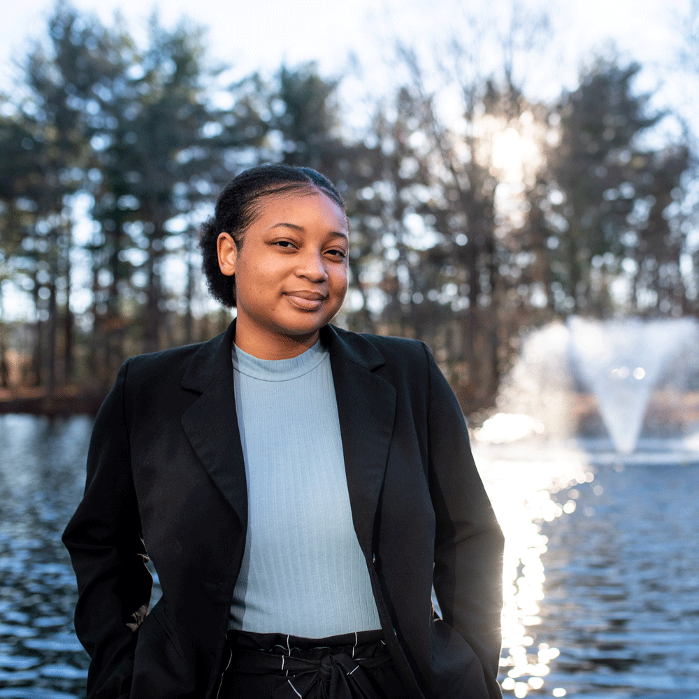 Tiana smiles in front of Engineering pond.