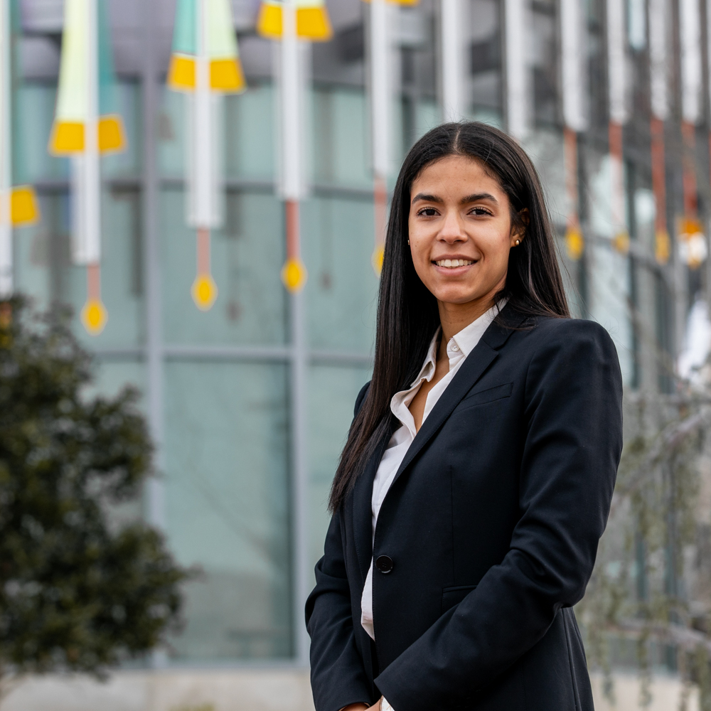 Joslyn smiles in front of Business Hall.