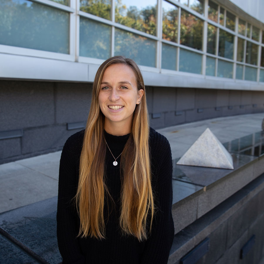 Casey W. sits outside Engineering Hall