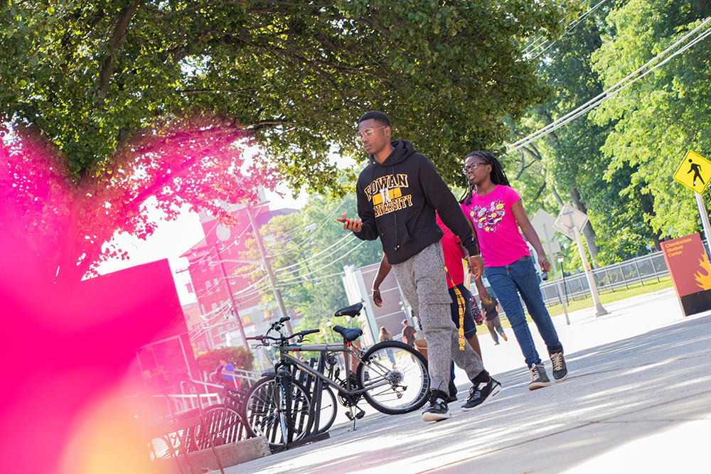 Students walk through Rowan University's campus to illustrate psychological sciences. 