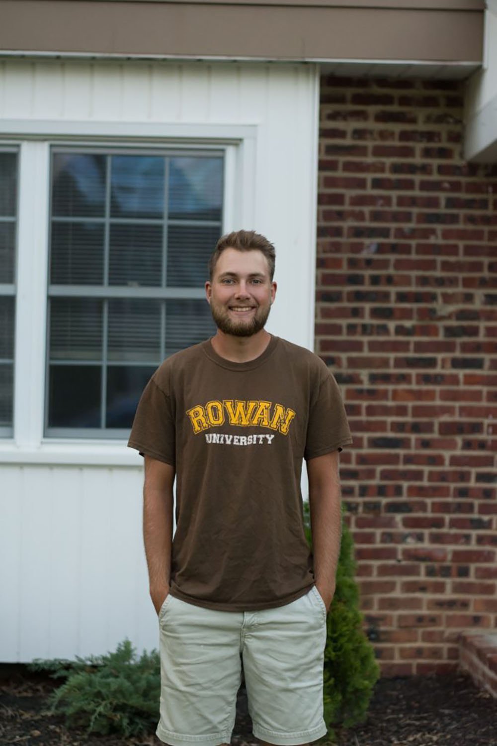 Psychology major Gregor J. wearing a Rowan T-shirt outside