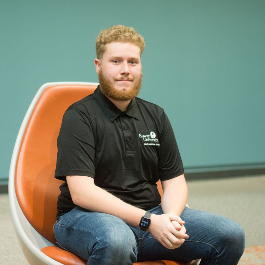 HPE major Mark F. sitting in an egg chair