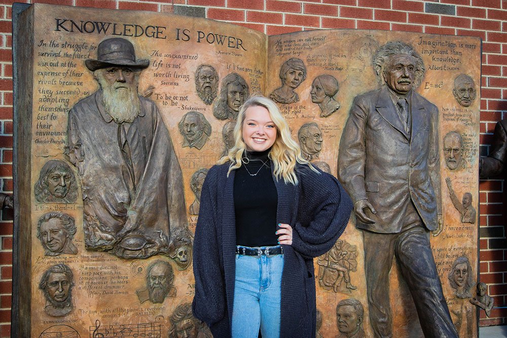 Molly standing in front of Einstein statue on Rowan's campus.