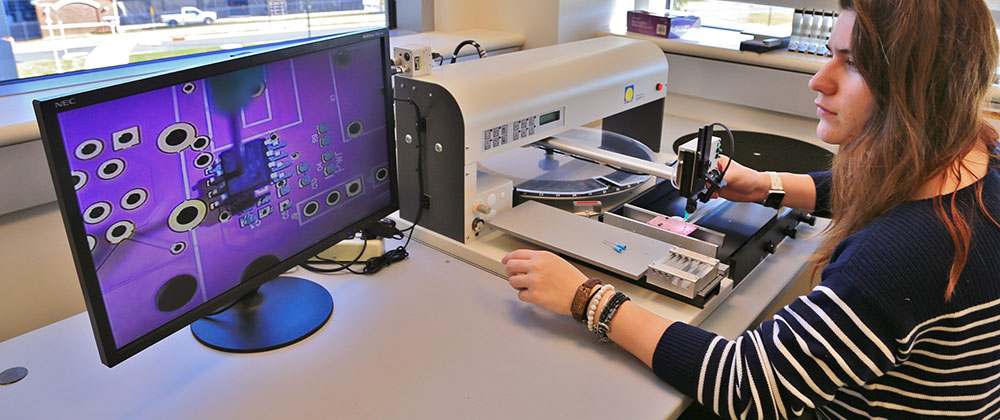 Female student working on desktop computer