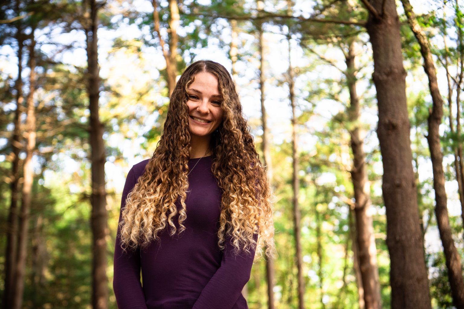 Lauren poses for a portrait behind Engineering Hall.