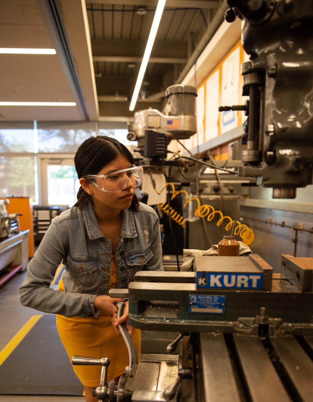 Giselle working in a mechanical engineering lab