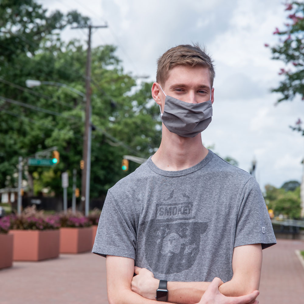 Ben wears a mask on campus.
