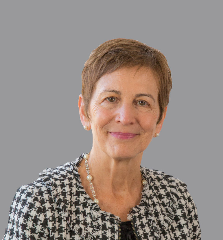 a portrait of Lucia with a grey background.