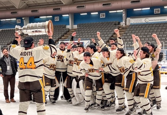 The Rowan hockey team celebrates a win. 