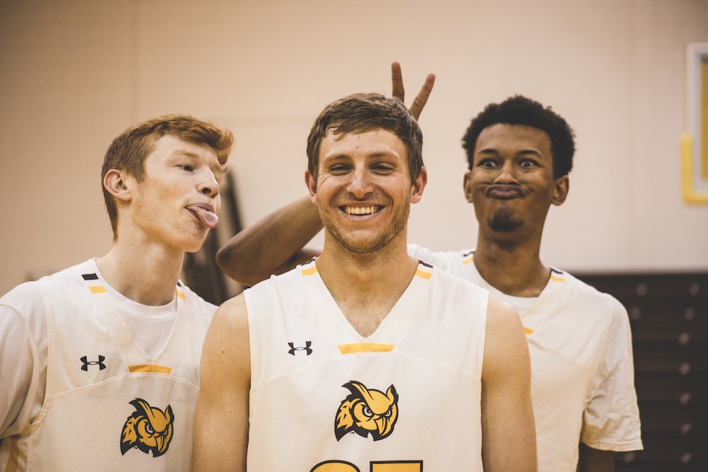 three mens basketball students being silly