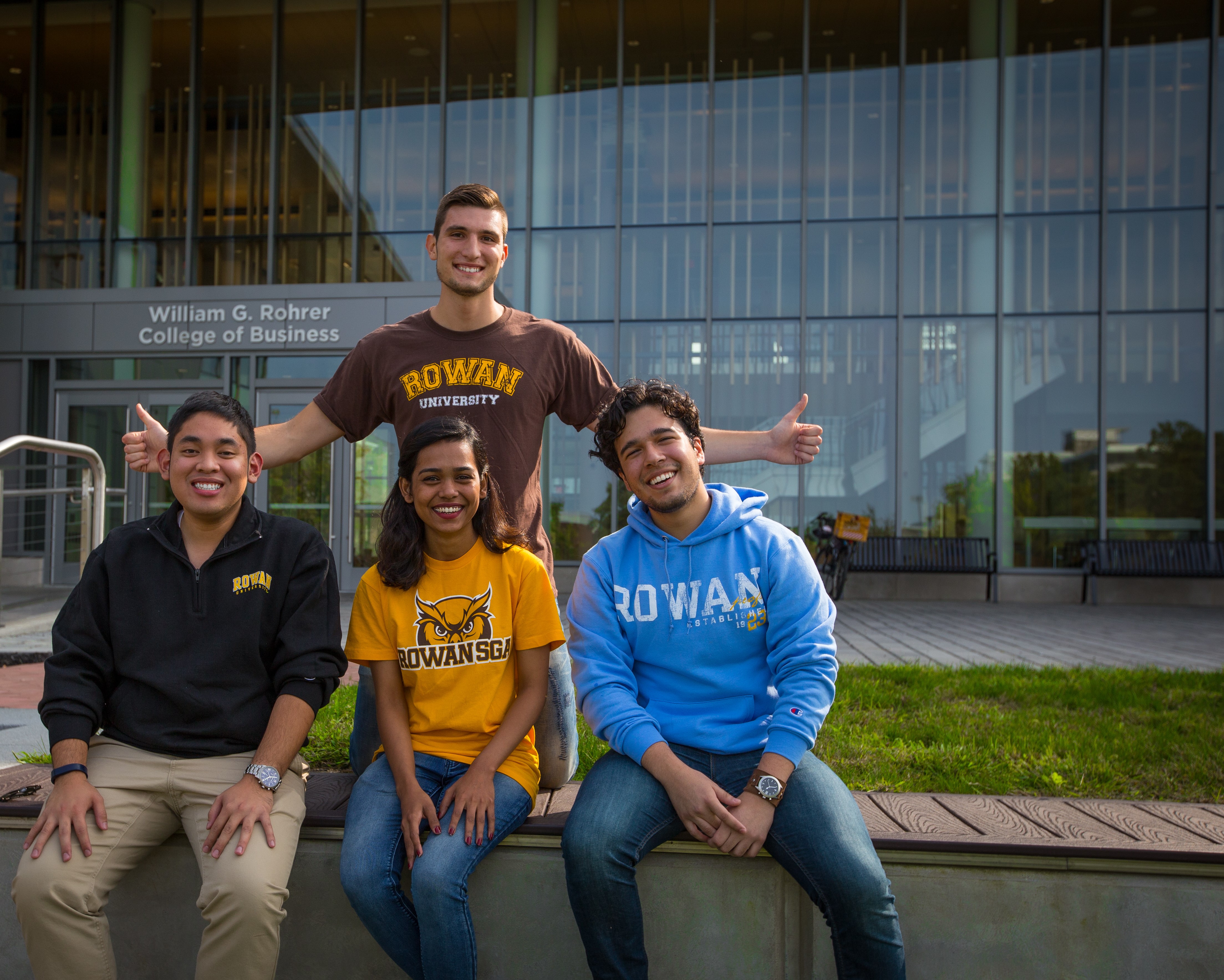 Two Rowan University students sitting outside together.