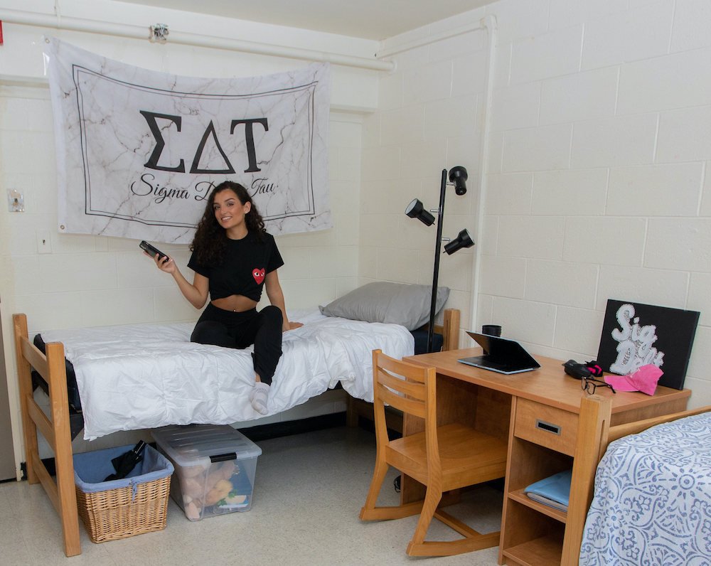 Rowan University student sits in her residence hall. 
