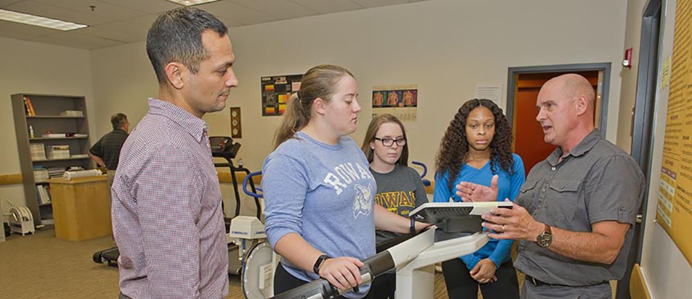 Rowan University exercise science students engage in discussion with a professor.